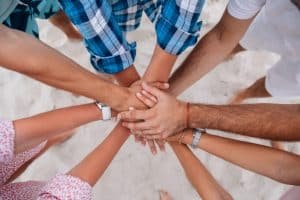 people-joining-hands-together