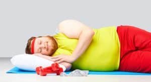 man sleeping on floor instead of exercising